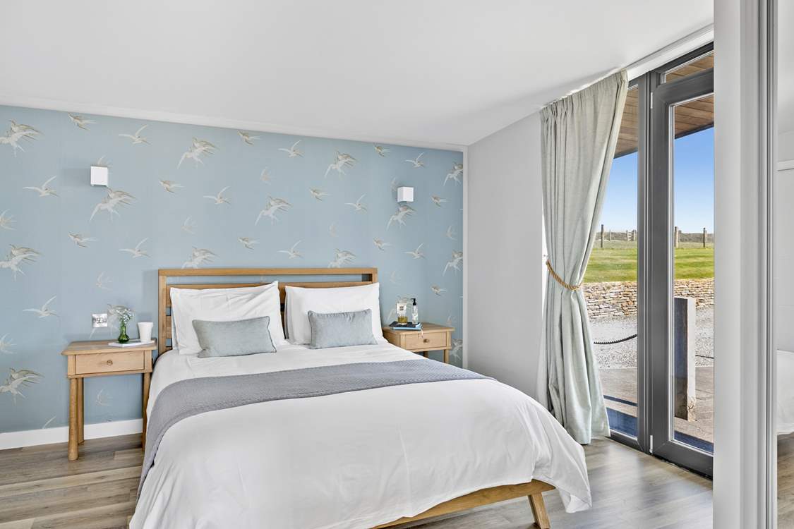 Bedroom 1 is decorated in muted tones making for a restful sleep.