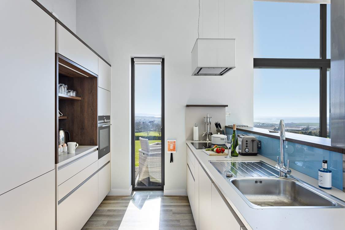 The fully equipped kitchen with views of the coast and beyond.