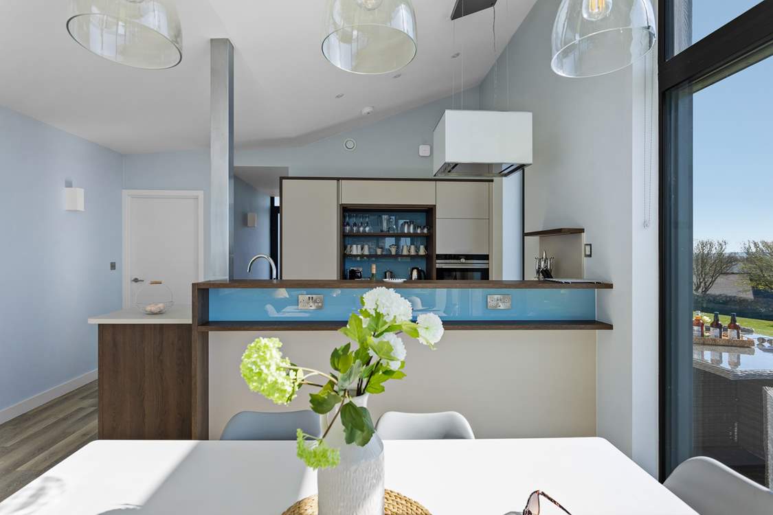 This modern and sleek holiday abode floods with light.