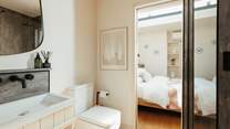 The bathroom resides between the main living space and the bedroom. 