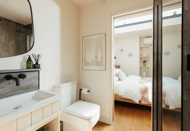 The bathroom resides between the main living space and the bedroom. 