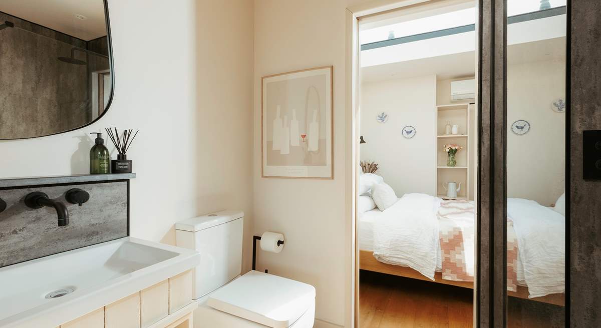 The bathroom resides between the main living space and the bedroom. 