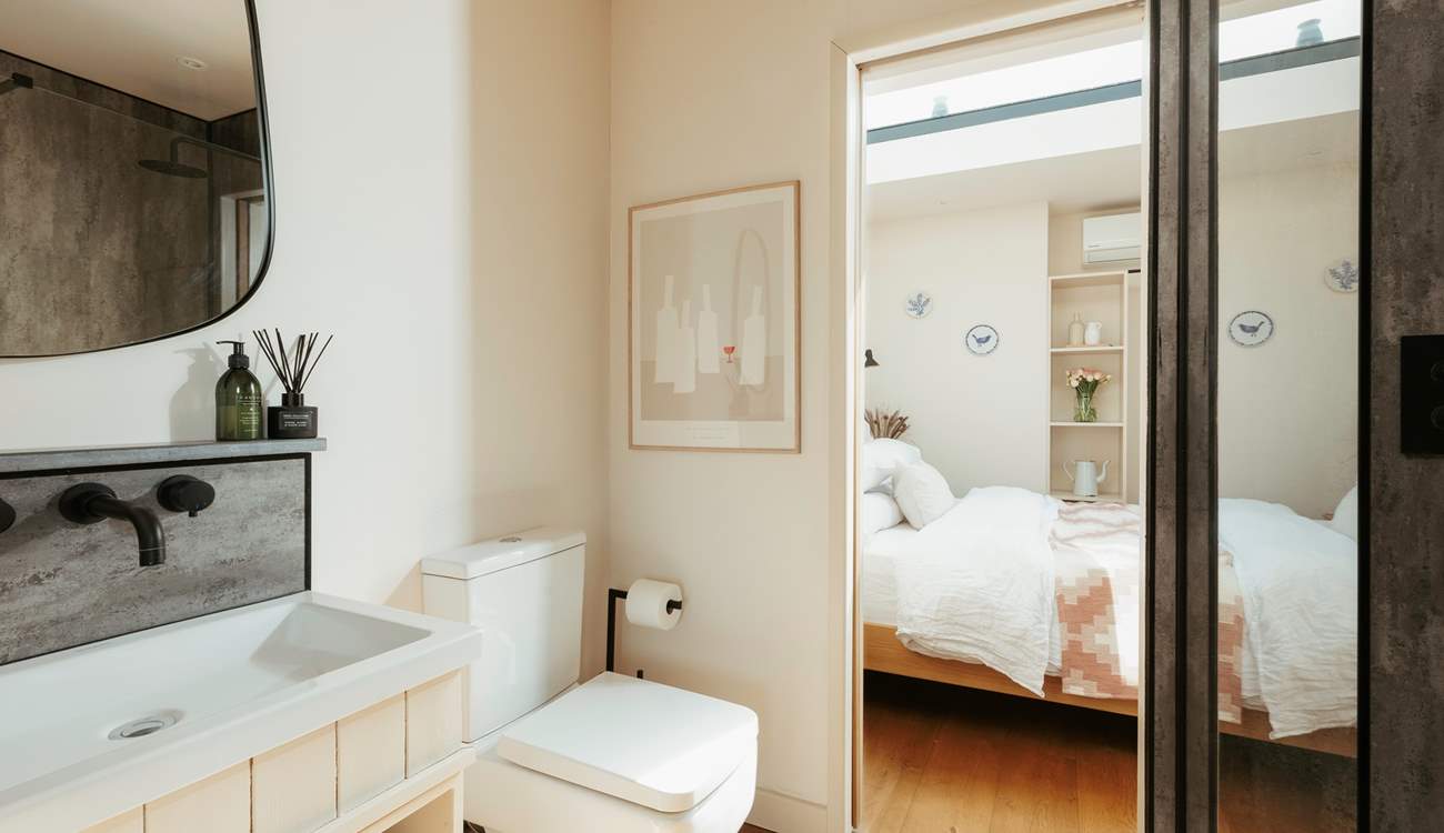 The bathroom resides between the main living space and the bedroom. 