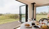 The bi-fold doors allow for the natural light to stream through.  - Thumbnail Image
