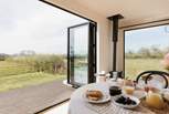 The bi-fold doors allow for the natural light to stream through. 