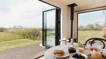 The bi-fold doors allow for the natural light to stream through. 