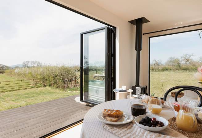 The bi-fold doors allow for the natural light to stream through. 