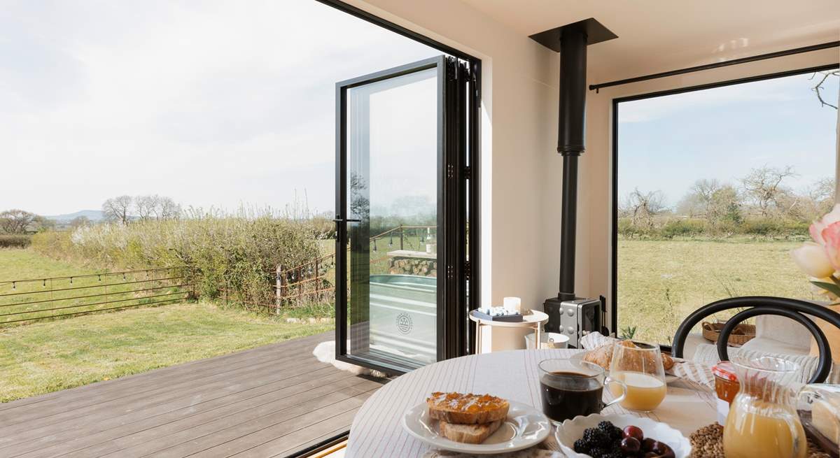 The bi-fold doors allow for the natural light to stream through. 