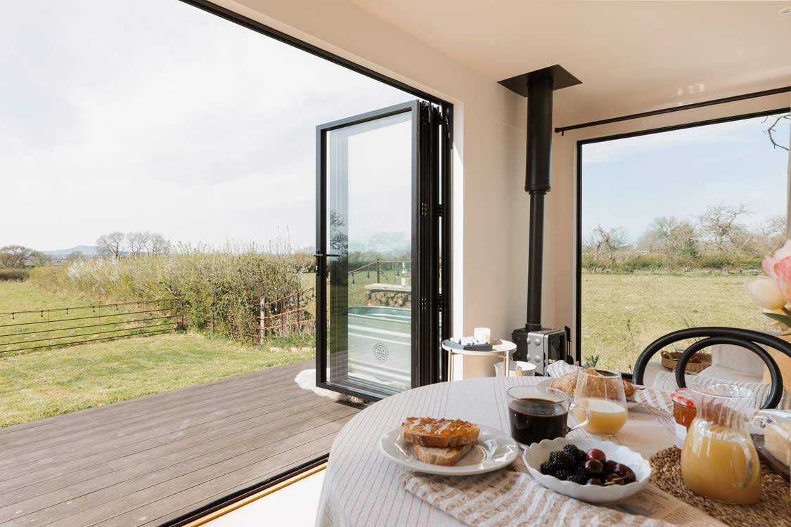 The bi-fold doors allow for the natural light to stream through.