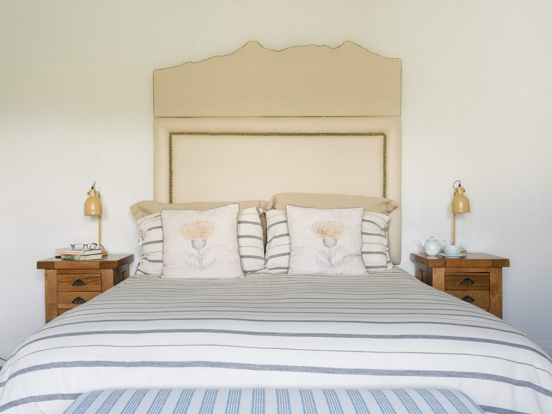 The headboard mirrors the shape of the mountains you see from the garden. 