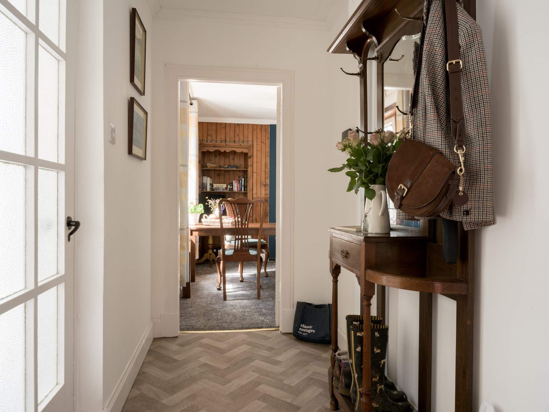 The large hallway has plenty of space for walking boots and picnic bags. 