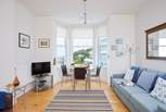 A high ceiling and lots of natural light enhance this beautiful space.