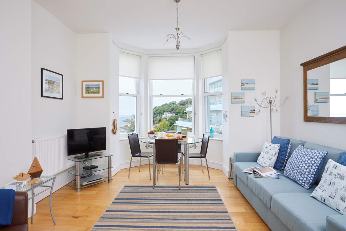 A high ceiling and lots of natural light enhance this beautiful space.