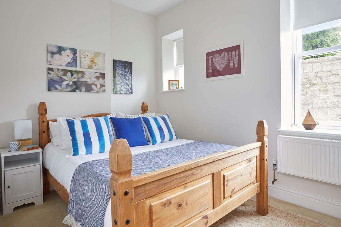 The main bedroom with an inviting king-size bed.