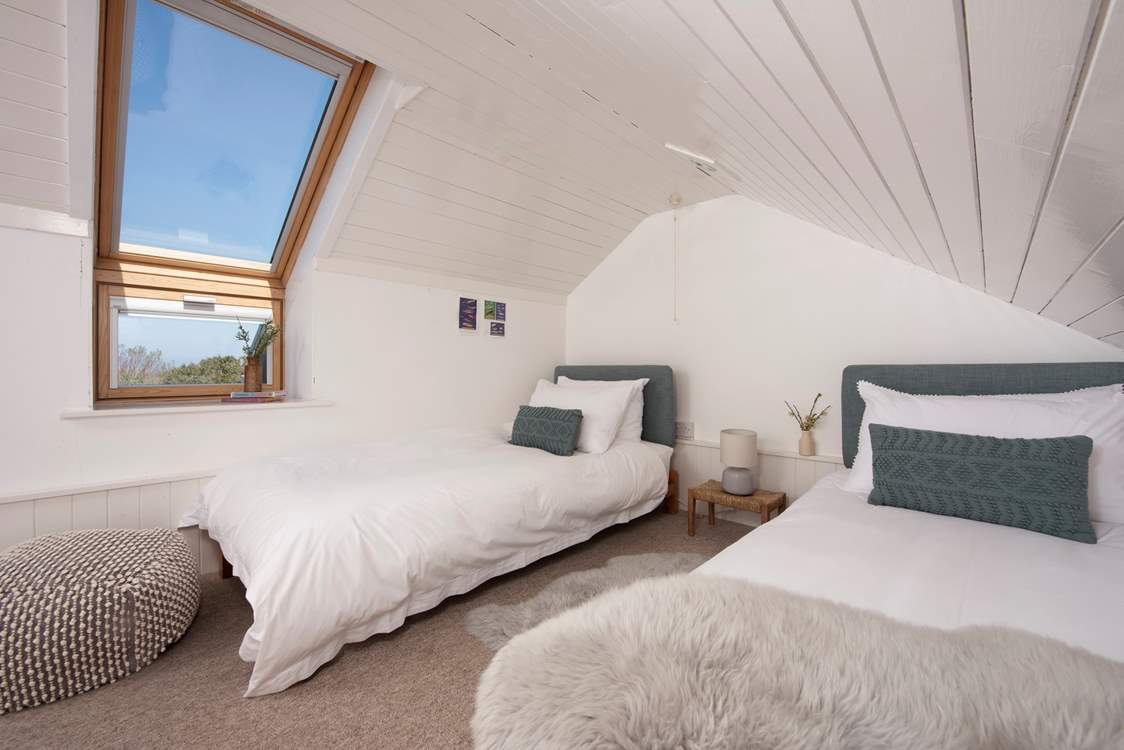 On the first floor, tucked under the eaves is the twin bedded room.