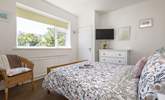 The main bedroom has lovely views of the private garden. - Thumbnail Image