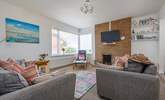 Relax on the comfy sofas in the light-filled sitting-room. - Thumbnail Image