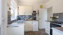Cook up a feast in the well-equipped kitchen.