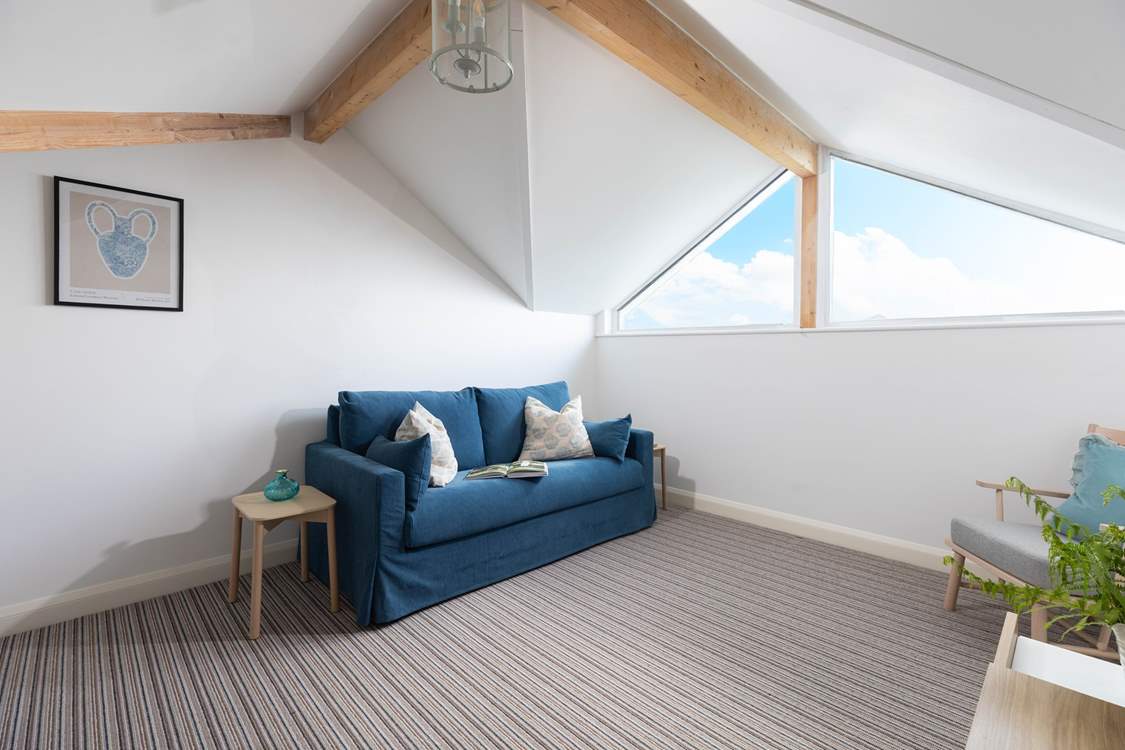 Huge windows fill the room with light.