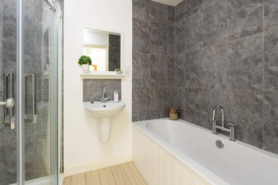 The family bathroom for the twin rooms to share, beautiful panelled bath and a separate power shower.