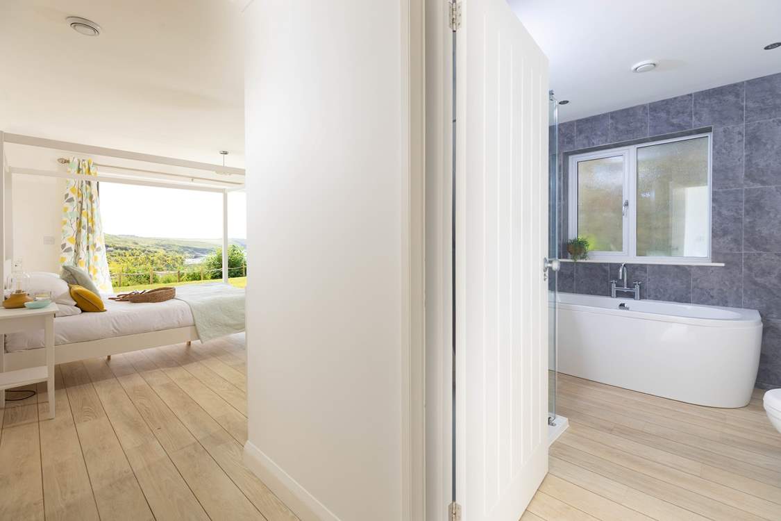 An enviable en suite with freestanding bath and separate power shower.