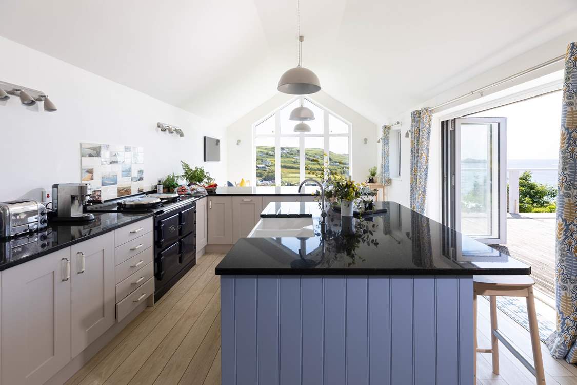 A kitchen to please any chef, with top spec integrated appliances and an electric Aga to cook up a feast.