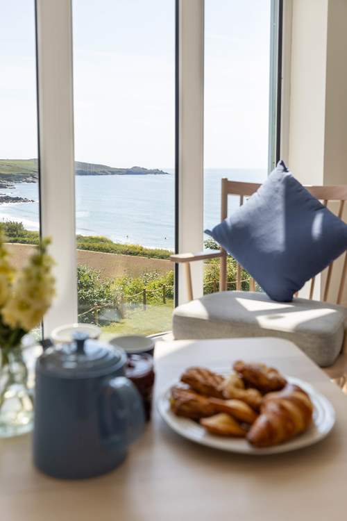 An inviting sandy beach is just a few minutes walk from this lovely home.