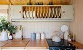 The cute kitchen is well-equipped for your getaway.  - Thumbnail Image