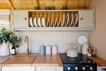 The cute kitchen is well-equipped for your getaway. 