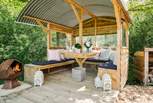 Light the fire pit, sit back, and relax in the gorgeous outdoor seating area. 