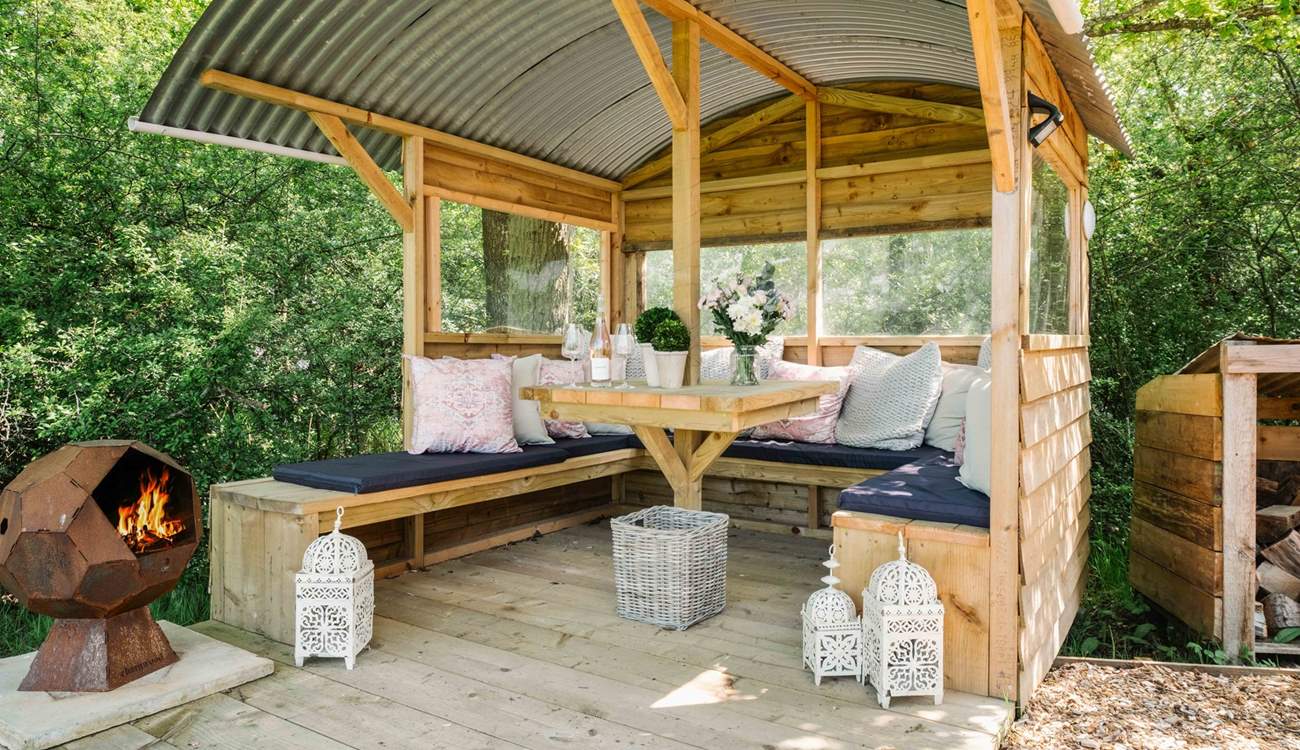 Light the fire-pit, sit back, and relax in the gorgeous outdoor seating area. 