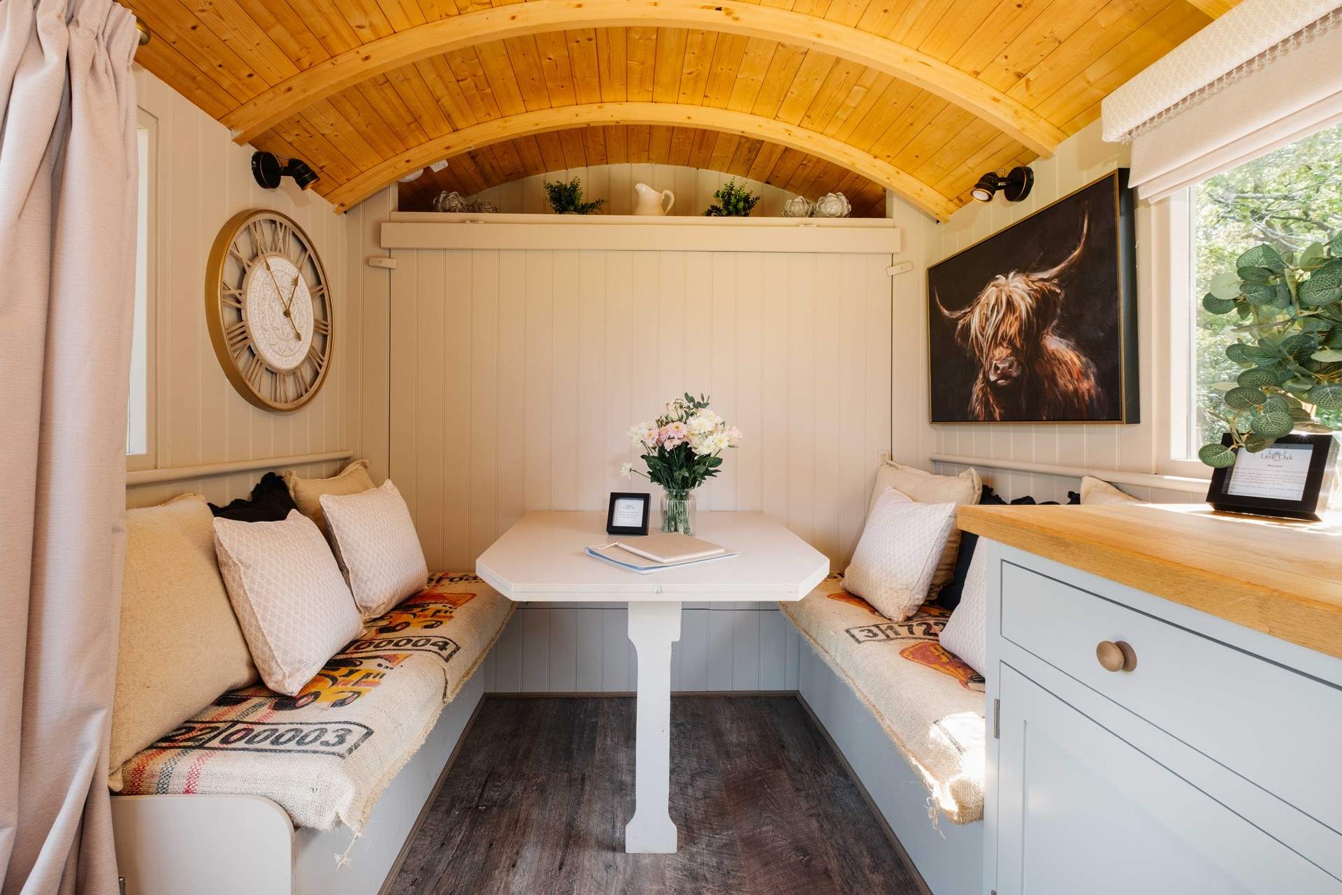 The bed folds up against the wall to reveal the lovely indoor dining space. 