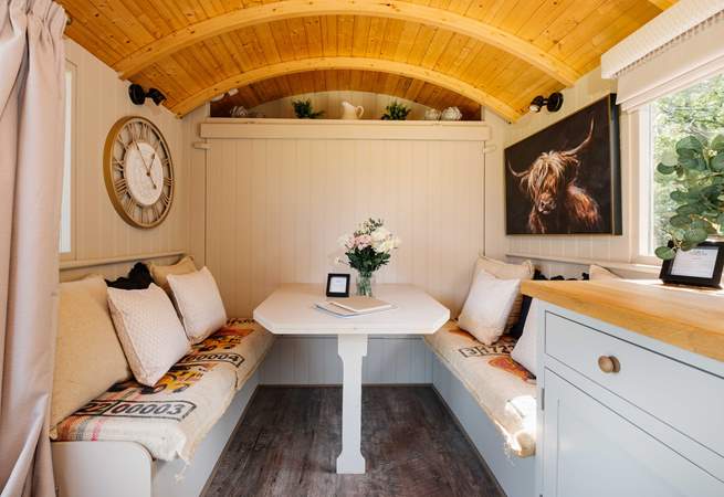 The bed folds up against the wall to reveal the lovely indoor dining space. 