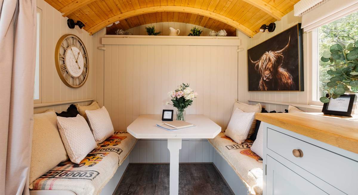 The bed folds up against the wall to reveal the lovely indoor dining space. 