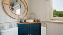 The luxurious interiors flow through to the en suite shower-room. 