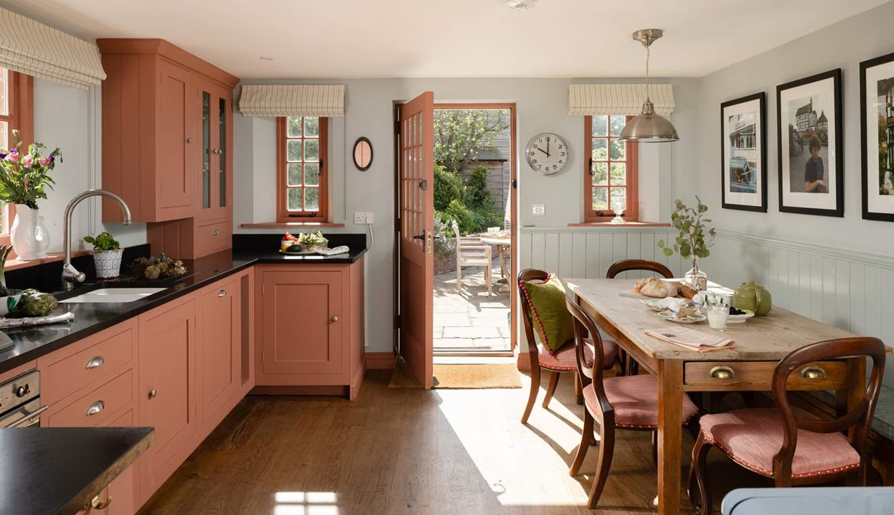 The spacious kitchen/dining-room is just the place to gather for memorable meals.