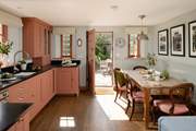 The spacious kitchen/dining-room is just the place to gather for memorable meals.