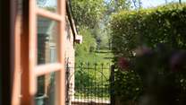 Go though the gate and wander in the acres of land.