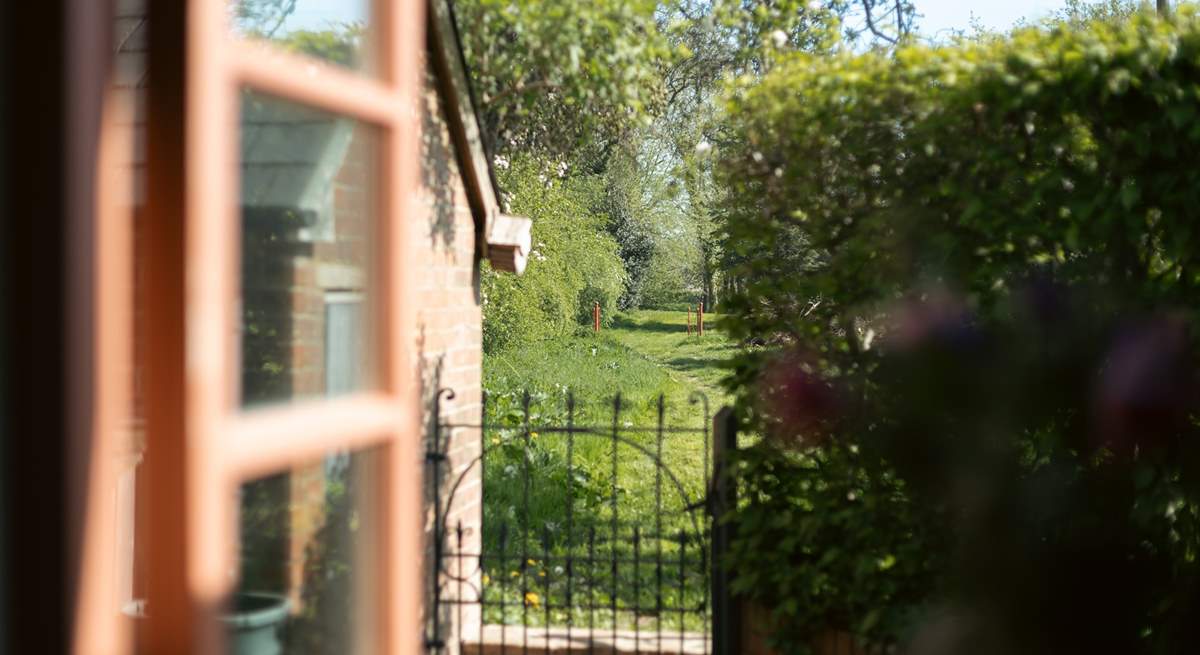 Go though the gate and wander in the acres of land.