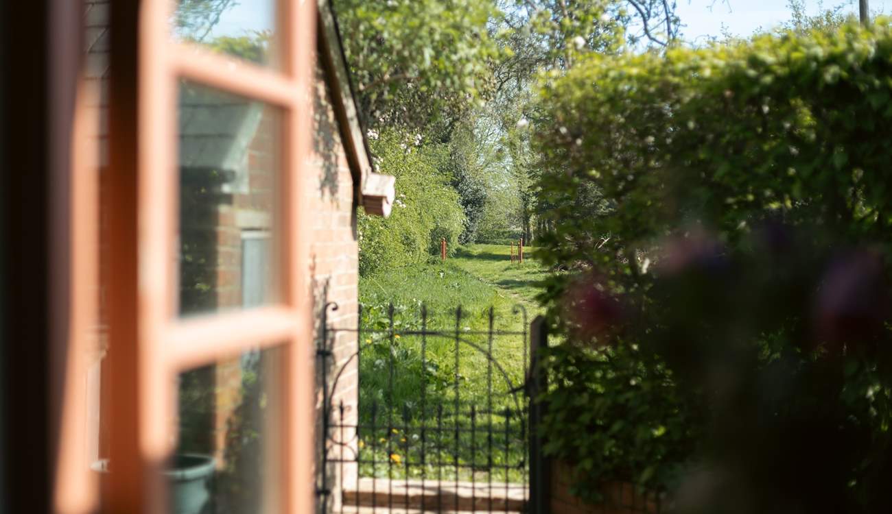 Go though the gate and wander in the acres of land.