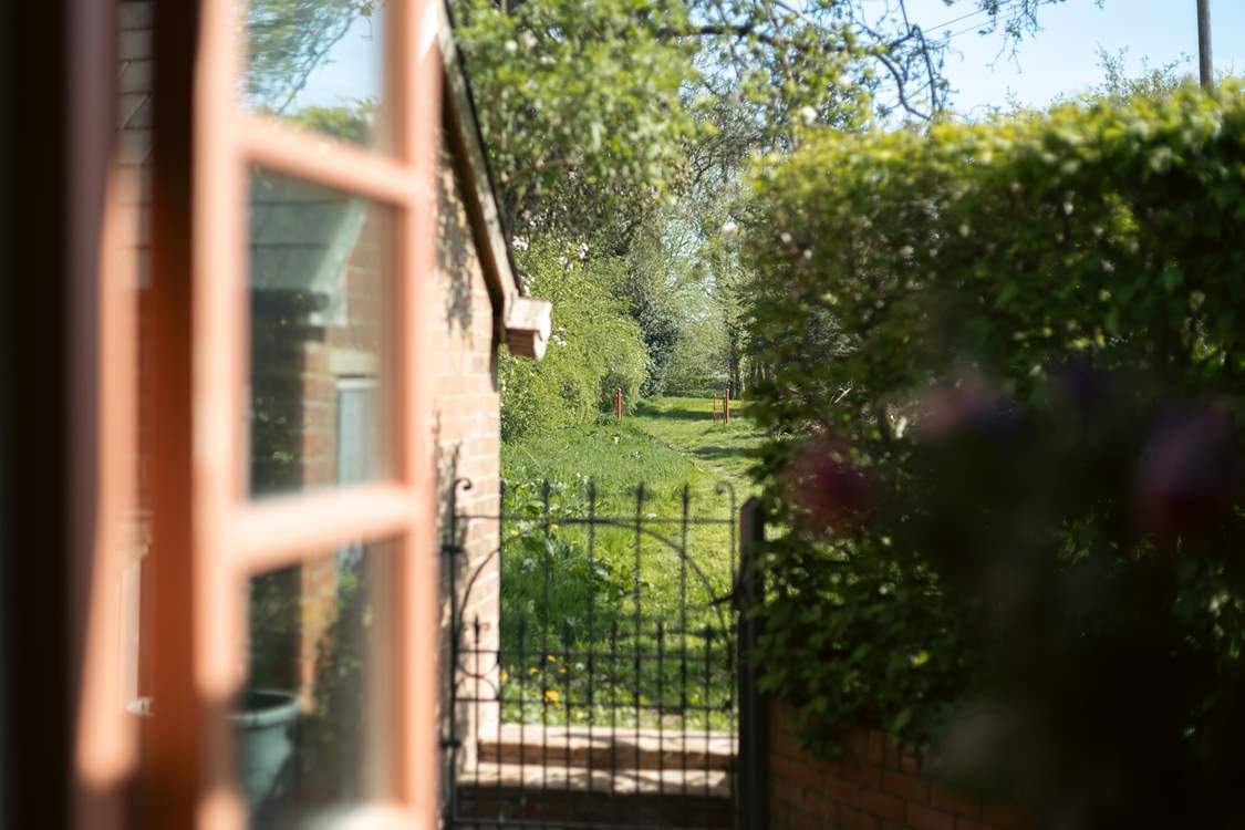 Go though the gate and wander in the acres of land.