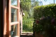 Go though the gate and wander in the acres of land.
