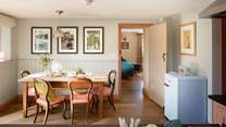 The lovely old farmhouse table sets the scene for family gatherings. 