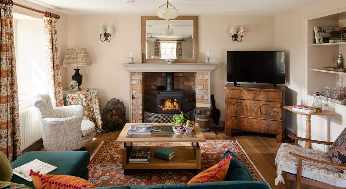The sitting-room is cosy in any season. 