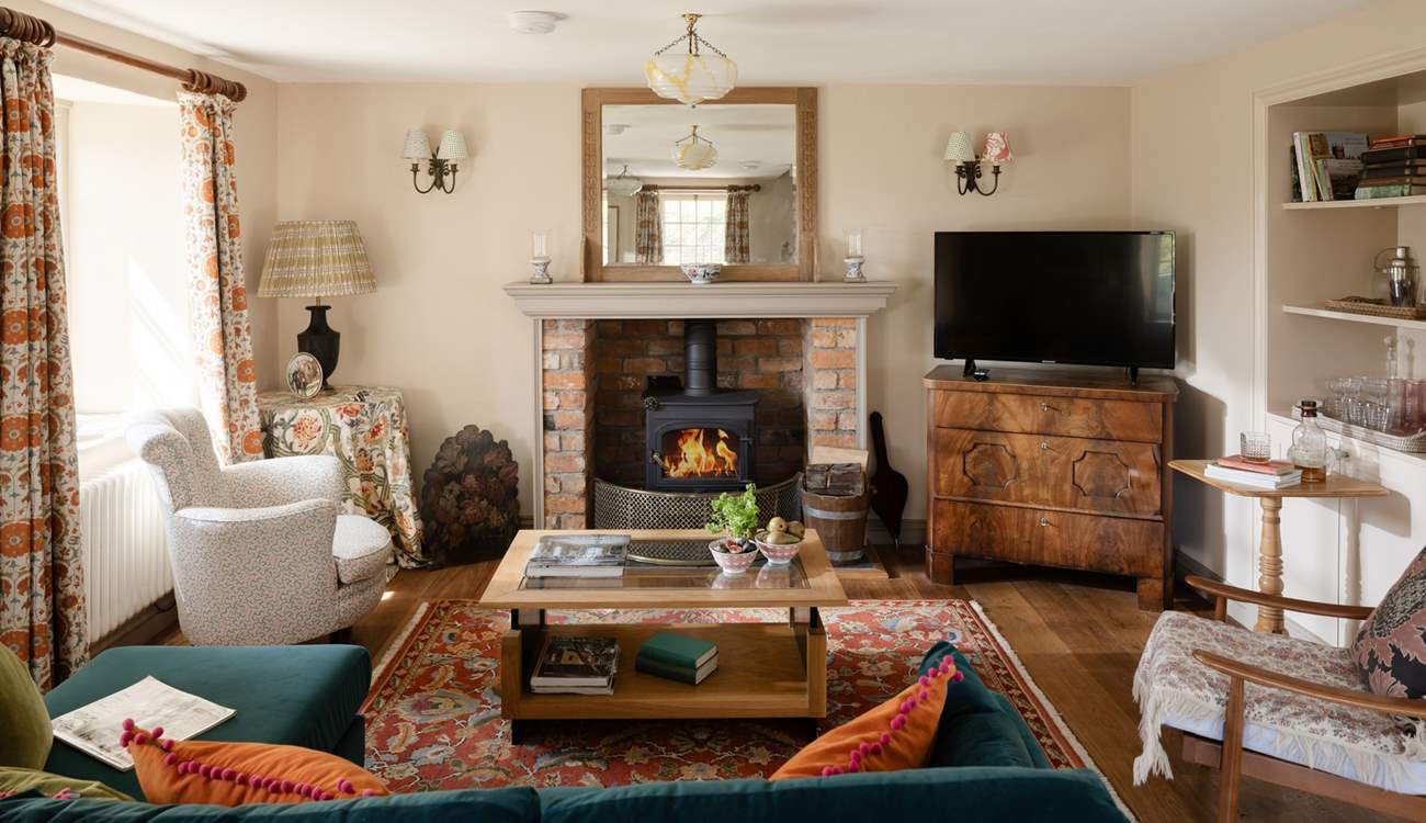 The sitting-room is cosy in any season. 