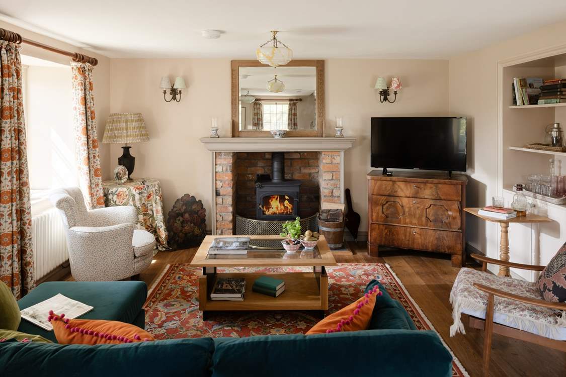 The sitting-room is cosy in any season.