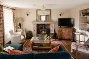 The sitting-room is cosy in any season.