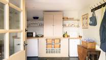 The large utility houses some kitchen equipment.