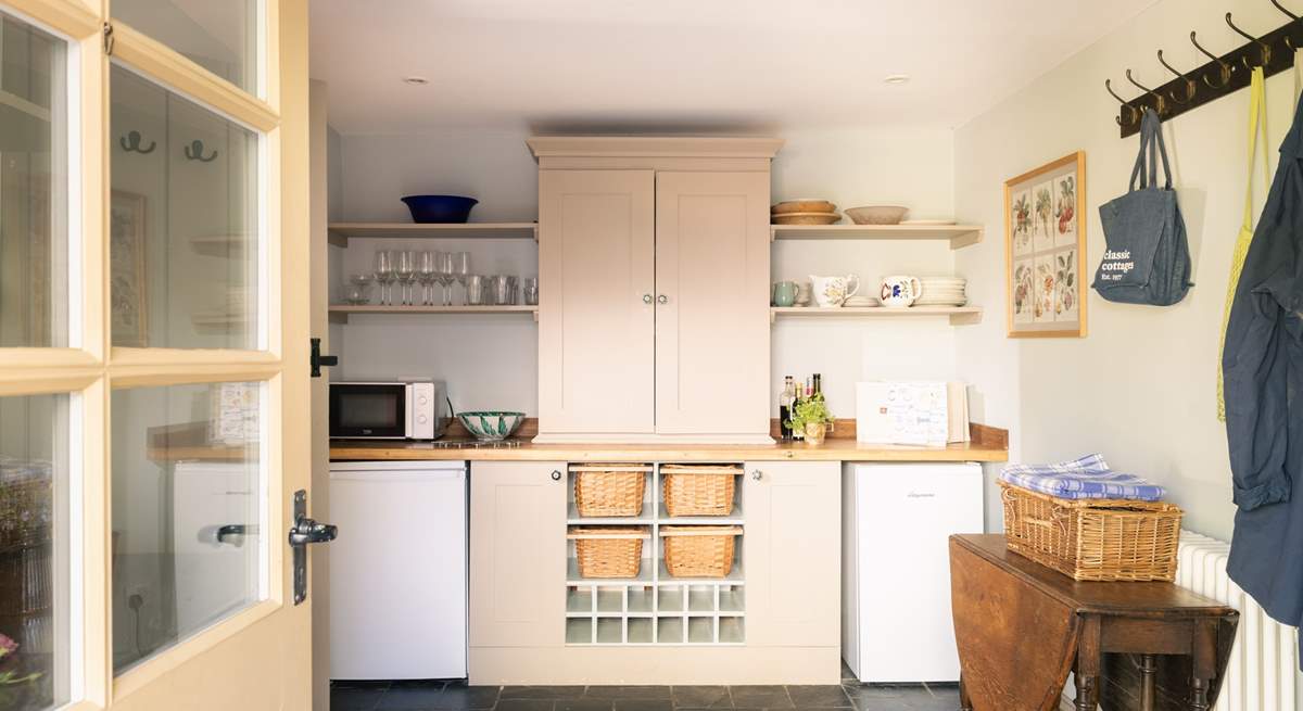 The large utility houses some kitchen equipment.