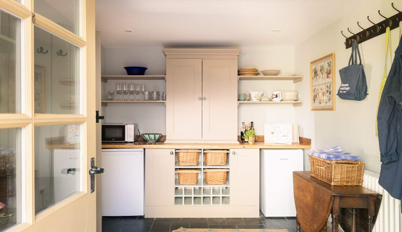 The large utility houses some kitchen equipment.